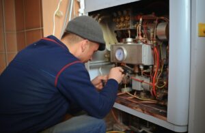 Man performing HVAC repair